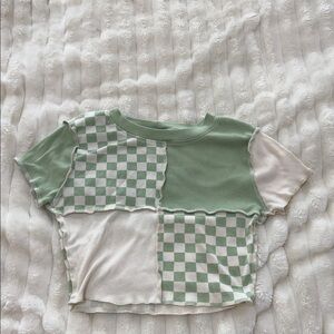checkered green and cream colored patchwork baby t